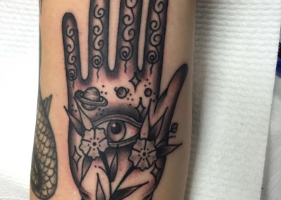 Spiritual hand tribal tattoo